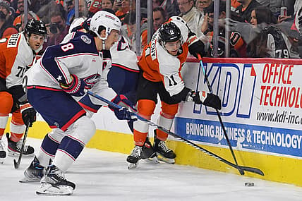 Nov 19, 2023; Philadelphia, Pennsylvania, USA; Columbus Blue Jackets defenseman Zach Werenski (8) and Philadelphia Flyers right wing Travis Konecny (11) battle for the puck during the first period at Wells Fargo Center. Mandatory Credit: Eric Hartline-USA TODAY Sports