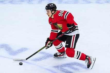 Nov 19, 2023; Chicago, Illinois, USA; Chicago Blackhawks center Connor Bedard (98) skates with the puck against the Buffalo Sabres during the third period at the United Center. Mandatory Credit: Daniel Bartel-USA TODAY Sports