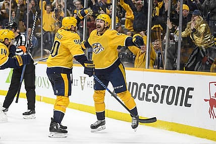 Nov 20, 2023; Nashville, Tennessee, USA; Nashville Predators left wing Filip Forsberg (9) celebrates as he scores the timing goal late against the Colorado Avalanche during the third period at Bridgestone Arena. Mandatory Credit: Steve Roberts-USA TODAY Sports