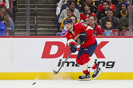 Nov 22, 2023; Sunrise, Florida, USA; Florida Panthers center Sam Reinhart (13) passes the puck against the Boston Bruins during the first period at Amerant Bank Arena. Mandatory Credit: Sam Navarro-USA TODAY Sports