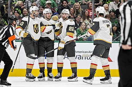 Nov 22, 2023; Dallas, Texas, USA; Vegas Golden Knights center Nicolas Roy (10) and right wing Michael Amadio (22) and center Ivan Barbashev (49) and defenseman Alex Pietrangelo (7) celebrates a goal scored by Amadio against the Dallas Stars during the first period at the American Airlines Center. Mandatory Credit: Jerome Miron-USA TODAY Sports