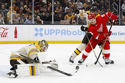Nov 24, 2023; Boston, Massachusetts, USA; Detroit Red Wings right wing Alex DeBrincat (93) goes for a rebound in front of Boston Bruins goaltender Jeremy Swayman (1) during the second period at TD Garden. Mandatory Credit: Winslow Townson-USA TODAY Sports