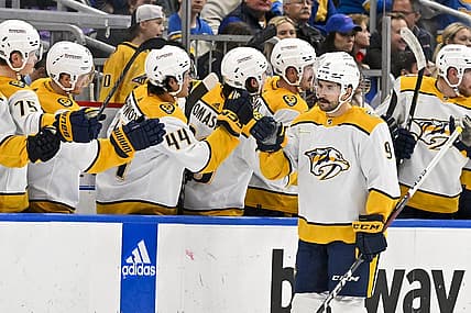 Nov 24, 2023; St. Louis, Missouri, USA;  Nashville Predators left wing Filip Forsberg (9) is congratulated by teammates after scoring against the St. Louis Blues during the second period at Enterprise Center. Mandatory Credit: Jeff Curry-USA TODAY Sports