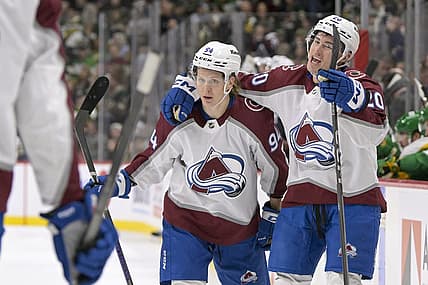 Nov 24, 2023; Saint Paul, Minnesota, USA; Colorado Avalanche forward Ross Colton (20) celebrates his goal against the Minnesota Wild with forward forward Joel Kiviranta (94) during the first period at Xcel Energy Center. Mandatory Credit: Nick Wosika-USA TODAY Sports