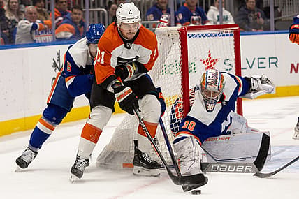 Nov 25, 2023; Elmont, New York, USA; Philadelphia Flyers right wing Travis Konecny (11) with the puck in front of New York Islanders goaltender Ilya Sorokin (30) during the first period at UBS Arena. Mandatory Credit: Thomas Salus-USA TODAY Sports