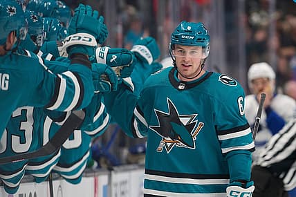 Nov 25, 2023; San Jose, California, USA; San Jose Sharks defenseman Ty Emberson (6) shakes hands with his teammates after scoring a goal against the Vancouver Canucks during the first period at SAP Center at San Jose. Mandatory Credit: Robert Edwards-USA TODAY Sports