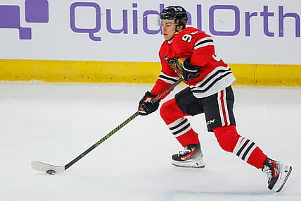 Nov 26, 2023; Chicago, Illinois, USA; Chicago Blackhawks center Connor Bedard (98) skates with the puck against the St. Louis Blues during the first period at United Center. Mandatory Credit: Kamil Krzaczynski-USA TODAY Sports