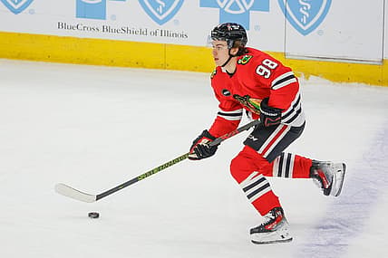 Nov 26, 2023; Chicago, Illinois, USA; Chicago Blackhawks center Connor Bedard (98) controls the puck against the St. Louis Blues during the first period at United Center. Mandatory Credit: Kamil Krzaczynski-USA TODAY Sports