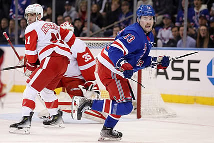 Nov 29, 2023; New York, New York, USA; New York Rangers left wing Alexis Lafreniere (13) skates against Detroit Red Wings defenseman Shayne Gostisbehere (41) and goaltender Ville Husso (35) during the first period at Madison Square Garden. Mandatory Credit: Brad Penner-USA TODAY Sports