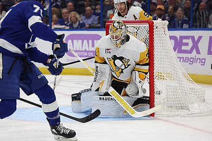 Nov 30, 2023; Tampa, Florida, USA; Pittsburgh Penguins goaltender Tristan Jarry (35) makes save from Tampa Bay Lightning center Anthony Cirelli (71) during the first period at Amalie Arena. Mandatory Credit: Kim Klement Neitzel-USA TODAY Sports