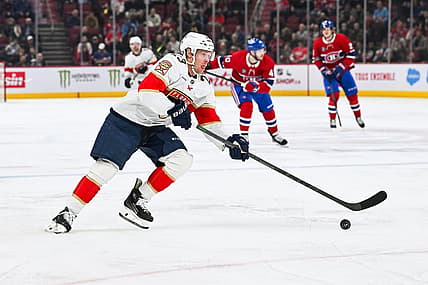 Nov 30, 2023; Montreal, Quebec, CAN; Florida Panthers center Carter Verhaeghe (23) plays the puck against the Montreal Canadiens during the second period at Bell Centre. Mandatory Credit: David Kirouac-USA TODAY Sports