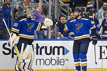 Mar 21, 2023; St. Louis, Missouri, USA;  St. Louis Blues defenseman Robert Bortuzzo (41) is congratulated by goaltender Joel Hofer (30) after scoring against the Detroit Red Wings during the first period at Enterprise Center. Mandatory Credit: Jeff Curry-USA TODAY Sports