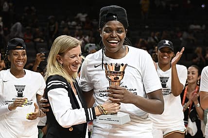 Aug 15, 2023; Las Vegas, Nevada, USA; WNBA Commissioner Cathy Engelbert hands New York Liberty forward Jonquel Jones the MVP trophy for the Commissioner   s Cup Championship game after defeating the Las Vegas Aces at Michelob Ultra Arena. Mandatory Credit: Candice Ward-USA TODAY Sports
