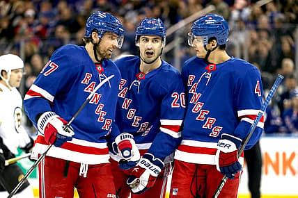 Nov 25, 2023; New York, New York, USA; New York Rangers left wing Chris Kreider (20) talks with right wing Blake Wheeler (17) and defenseman Braden Schneider (4) during the first period against the Boston Bruins at Madison Square Garden. Mandatory Credit: Danny Wild-USA TODAY Sports