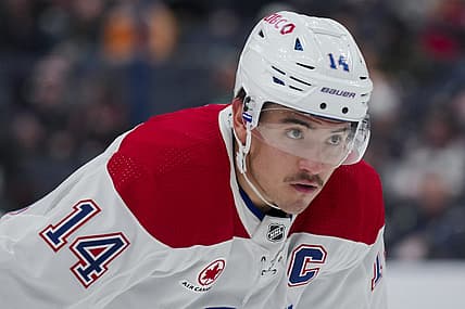 Nov 29, 2023; Columbus, Ohio, USA;  Montreal Canadiens center Nick Suzuki (14) awaits the face-off against the Columbus Blue Jackets in the first period at Nationwide Arena. Mandatory Credit: Aaron Doster-USA TODAY Sports