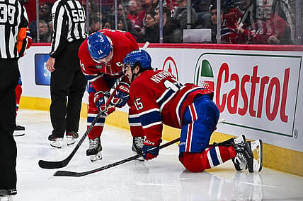 Nov 30, 2023; Montreal, Quebec, CAN; Montreal Canadiens center Alex Newhook (15) gets injured on a play against the Florida Panthers during the third period at Bell Centre. Mandatory Credit: David Kirouac-USA TODAY Sports