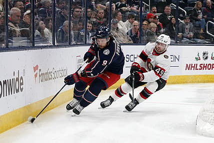 Dec 1, 2023; Columbus, Ohio, USA; Columbus Blue Jackets defenseman Ivan Provorov (9) and Ottawa Senators center Rourke Chartier (49) chase down loose puck during the first period at Nationwide Arena. Mandatory Credit: Russell LaBounty-USA TODAY Sports