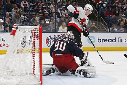 Dec 1, 2023; Columbus, Ohio, USA; Ottawa Senators left wing Brady Tkachuk (7) tips the puck wide of Columbus Blue Jackets goalie Elvis Merzlikins (90) during the third period at Nationwide Arena. Mandatory Credit: Russell LaBounty-USA TODAY Sports