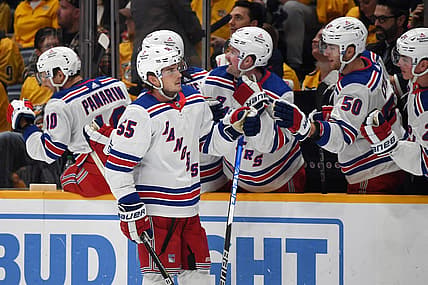 Dec 2, 2023; Nashville, Tennessee, USA; New York Rangers defenseman Ryan Lindgren (55) is congratulated by teammates after a goal during the third period against the Nashville Predators at Bridgestone Arena. Mandatory Credit: Christopher Hanewinckel-USA TODAY Sports