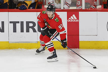 Dec 5, 2023; Chicago, Illinois, USA; Chicago Blackhawks left wing Anthony Beauvillier (91) looks to pass the puck against the Nashville Predators during the third period at United Center. Mandatory Credit: Kamil Krzaczynski-USA TODAY Sports