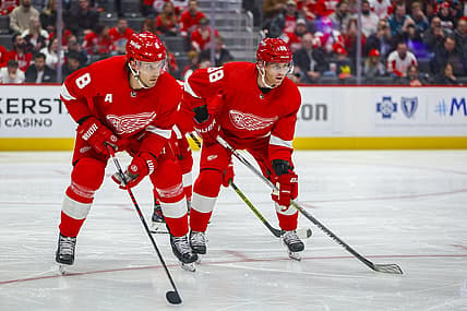 Dec 7, 2023; Detroit, Michigan, USA; Detroit Red Wings right wing Patrick Kane (88) and Detroit Red Wings defenseman Ben Chiarot (8) look on before a face off in the first period at Little Caesars Arena. Mandatory Credit: Brian Bradshaw Sevald-USA TODAY Sports