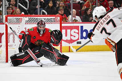Dec 7, 2023; Chicago, Illinois, USA; Chicago Blackhawks goaltender Petr Mrazek (34) tracks a shot from Anaheim Ducks forward Frank Vatrano (77) in the second period at United Center. Mandatory Credit: Jamie Sabau-USA TODAY Sports