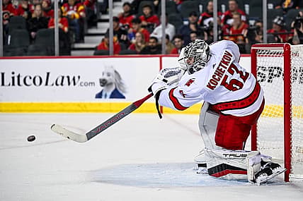Dec 7, 2023; Calgary, Alberta, CAN; Carolina Hurricanes goaltender Pyotr Kochetkov (52) passes the puck during the third period of a game against the Calgary Flames at Scotiabank Saddledome. Mandatory Credit: Brett Holmes-USA TODAY Sports
