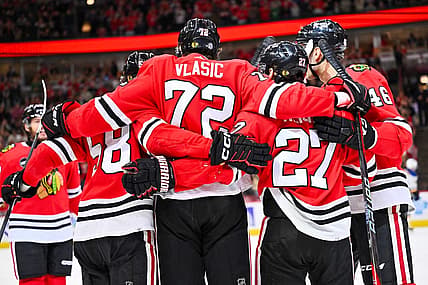 Dec 9, 2023; Chicago, Illinois, USA; Chicago Blackhawks defenseman Alex Vlasic (72) celebrates with teammates after scoring a goal in the first period against the St. Louis Blues at United Center. Mandatory Credit: Jamie Sabau-USA TODAY Sports