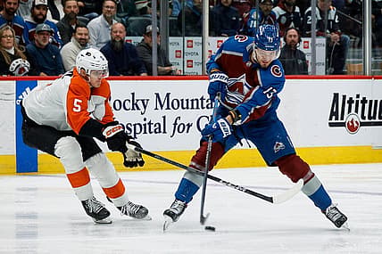 Dec 9, 2023; Denver, Colorado, USA; Colorado Avalanche right wing Valeri Nichushkin (13) shoots the puck as Philadelphia Flyers defenseman Egor Zamula (5) defends in the second period at Ball Arena. Mandatory Credit: Isaiah J. Downing-USA TODAY Sports