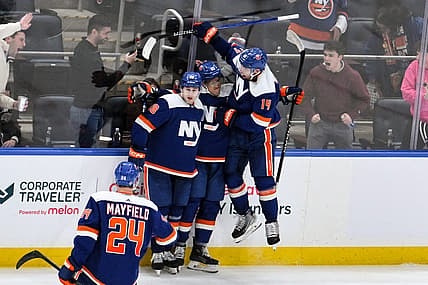 Dec 9, 2023; Elmont, New York, USA; New York Islanders left wing Anders Lee (27) celebrates with teammates after scoring a goal against the Los Angeles Kings during the third period at UBS Arena. Mandatory Credit: John Jones-USA TODAY Sports