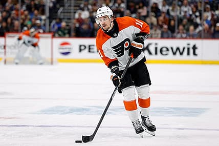 Dec 9, 2023; Denver, Colorado, USA; Philadelphia Flyers right wing Travis Konecny (11) controls the puck on a penalty shot in the third period against the Colorado Avalanche at Ball Arena. Mandatory Credit: Isaiah J. Downing-USA TODAY Sports