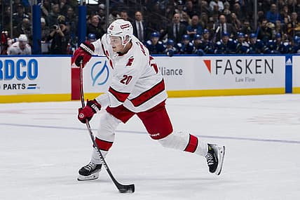 Dec 9, 2023; Vancouver, British Columbia, CAN; Carolina Hurricanes forward Sebastian Aho (20) shoots against the Vancouver Canucks in the second period at Rogers Arena. Mandatory Credit: Bob Frid-USA TODAY Sports