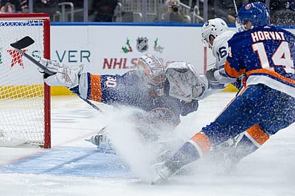 Dec 11, 2023; Elmont, New York, USA; New York Islanders goaltender Ilya Sorokin (30) makes a save after Toronto Maple Leafs right wing Mitchell Marner (16) takes a shot during the first period at UBS Arena. Mandatory Credit: Thomas Salus-USA TODAY Sports