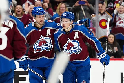 Dec 11, 2023; Denver, Colorado, USA; Colorado Avalanche defenseman Cale Makar (8) celebrates his goal with right wing Mikko Rantanen (96) in the second period against the Calgary Flames at Ball Arena. Mandatory Credit: Ron Chenoy-USA TODAY Sports