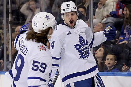 Dec 12, 2023; New York, New York, USA; Toronto Maple Leafs center Auston Matthews (34) celebrates his goal against the New York Rangers with left wing Tyler Bertuzzi (59) during the third period at Madison Square Garden. Mandatory Credit: Brad Penner-USA TODAY Sports