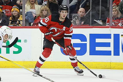 Dec 13, 2023; Newark, New Jersey, USA; New Jersey Devils center Jack Hughes (86) skates with the puck during the third period against the Boston Bruins at Prudential Center. Mandatory Credit: Vincent Carchietta-USA TODAY Sports