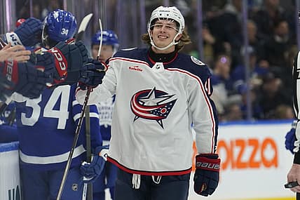 Dec 14, 2023; Toronto, Ontario, CAN; Columbus Blue Jackets forward Kent Johnson (91) gets congratulated after scoring against the Toronto Maple Leafs during the first period at Scotiabank Arena. Mandatory Credit: John E. Sokolowski-USA TODAY Sports