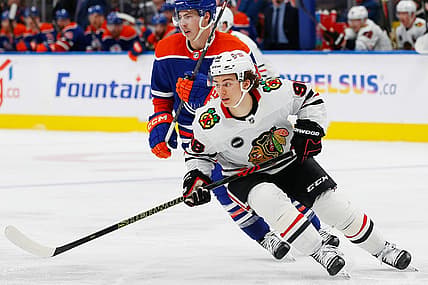 Dec 12, 2023; Edmonton, Alberta, CAN; Chicago Blackhawks forward Connor Bedard (98) looks for a loose puck against the Edmonton Oilers at Rogers Place. Mandatory Credit: Perry Nelson-USA TODAY Sports