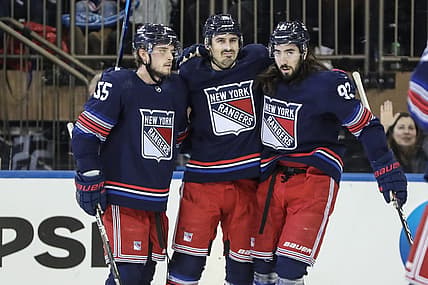 Dec 15, 2023; New York, New York, USA; New York Rangers left wing Chris Kreider (20) is greeted by defenseman Ryan Lindgren (55) and center Mika Zibanejad (93) after scoring a goal in the first period against the Anaheim Ducks at Madison Square Garden. Mandatory Credit: Wendell Cruz-USA TODAY Sports