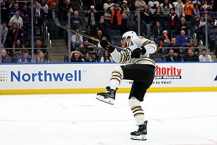 Dec 15, 2023; Elmont, New York, USA; Boston Bruins right wing David Pastrnak (88) follows through on the game winning goal during the shootout at UBS Arena. Mandatory Credit: Brad Penner-USA TODAY Sports