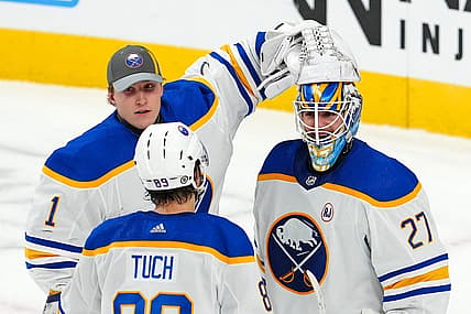 Dec 15, 2023; Las Vegas, Nevada, USA; Buffalo Sabres goaltender Devon Levi (27) celebrates with Buffalo Sabres goaltender Ukko-Pekka Luukkonen (1) and Buffalo Sabres right wing Alex Tuch (89) after the Sabres defeated the Vegas Golden Knights 5-2 at T-Mobile Arena. Mandatory Credit: Stephen R. Sylvanie-USA TODAY Sports