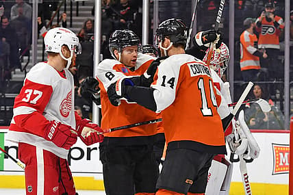 Dec 16, 2023; Philadelphia, Pennsylvania, USA; Philadelphia Flyers defenseman Cam York (8) celebrates his goal with center Sean Couturier (14) against the Detroit Red Wings during the first period at Wells Fargo Center. Mandatory Credit: Eric Hartline-USA TODAY Sports