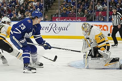 Dec 16, 2023; Toronto, Ontario, CAN; Toronto Maple Leafs forward Matthew Knies (23) scores against Pittsburgh Penguins goaltender Tristan Jarry (35) during the first period at Scotiabank Arena. Mandatory Credit: John E. Sokolowski-USA TODAY Sports