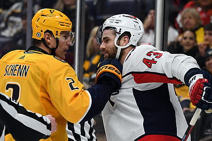 Dec 16, 2023; Nashville, Tennessee, USA; Nashville Predators defenseman Luke Schenn (2) grabs the jersey of Washington Capitals right wing Tom Wilson (43) after a play during the second period at Bridgestone Arena. Mandatory Credit: Christopher Hanewinckel-USA TODAY Sports