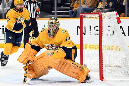 Dec 16, 2023; Nashville, Tennessee, USA; Nashville Predators goaltender Juuse Saros (74) watches a shot deflect into the corner during the second period against the Washington Capitals at Bridgestone Arena. Mandatory Credit: Christopher Hanewinckel-USA TODAY Sports