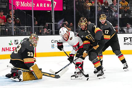 Dec 17, 2023; Las Vegas, Nevada, USA; Ottawa Senators left wing Angus Crookshank (59) attempts to shoot the puck in front of Vegas Golden Knights defenseman Alex Pietrangelo (7) and defenseman Ben Hutton (17) as  goaltender Adin Hill (33) defends his net during the first period at T-Mobile Arena. Mandatory Credit: Stephen R. Sylvanie-USA TODAY Sports