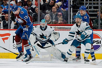 Dec 17, 2023; Denver, Colorado, USA; Colorado Avalanche right wing Valeri Nichushkin (13) screens San Jose Sharks goaltender Mackenzie Blackwood (29) on a shot as defenseman Kyle Burroughs (4) and right wing Mikko Rantanen (96) defend in the first period at Ball Arena. Mandatory Credit: Isaiah J. Downing-USA TODAY Sports