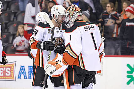 Dec 17, 2023; Newark, New Jersey, USA; Anaheim Ducks center Adam Henrique (14) celebrates with goaltender Lukas Dostal (1) after defeating the New Jersey Devils at Prudential Center. Mandatory Credit: Vincent Carchietta-USA TODAY Sports