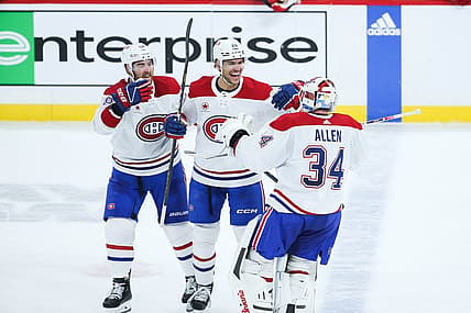 Dec 18, 2023; Winnipeg, Manitoba, CAN;  Montreal Canadiens goalie Jake Allen (34) is congratulated by his team mates on his win against the Winnipeg Jets at the end of the overtime period at Canada Life Centre. Mandatory Credit: Terrence Lee-USA TODAY Sports