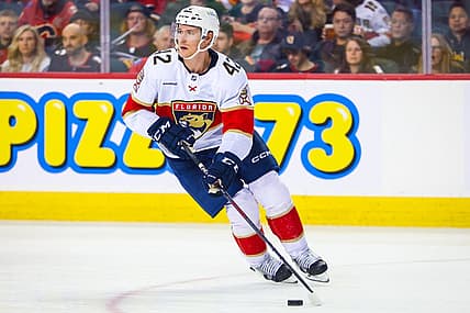 Dec 18, 2023; Calgary, Alberta, CAN; Florida Panthers defenseman Gustav Forsling (42) skates with the puck against the Calgary Flames during the third period at Scotiabank Saddledome. Mandatory Credit: Sergei Belski-USA TODAY Sports